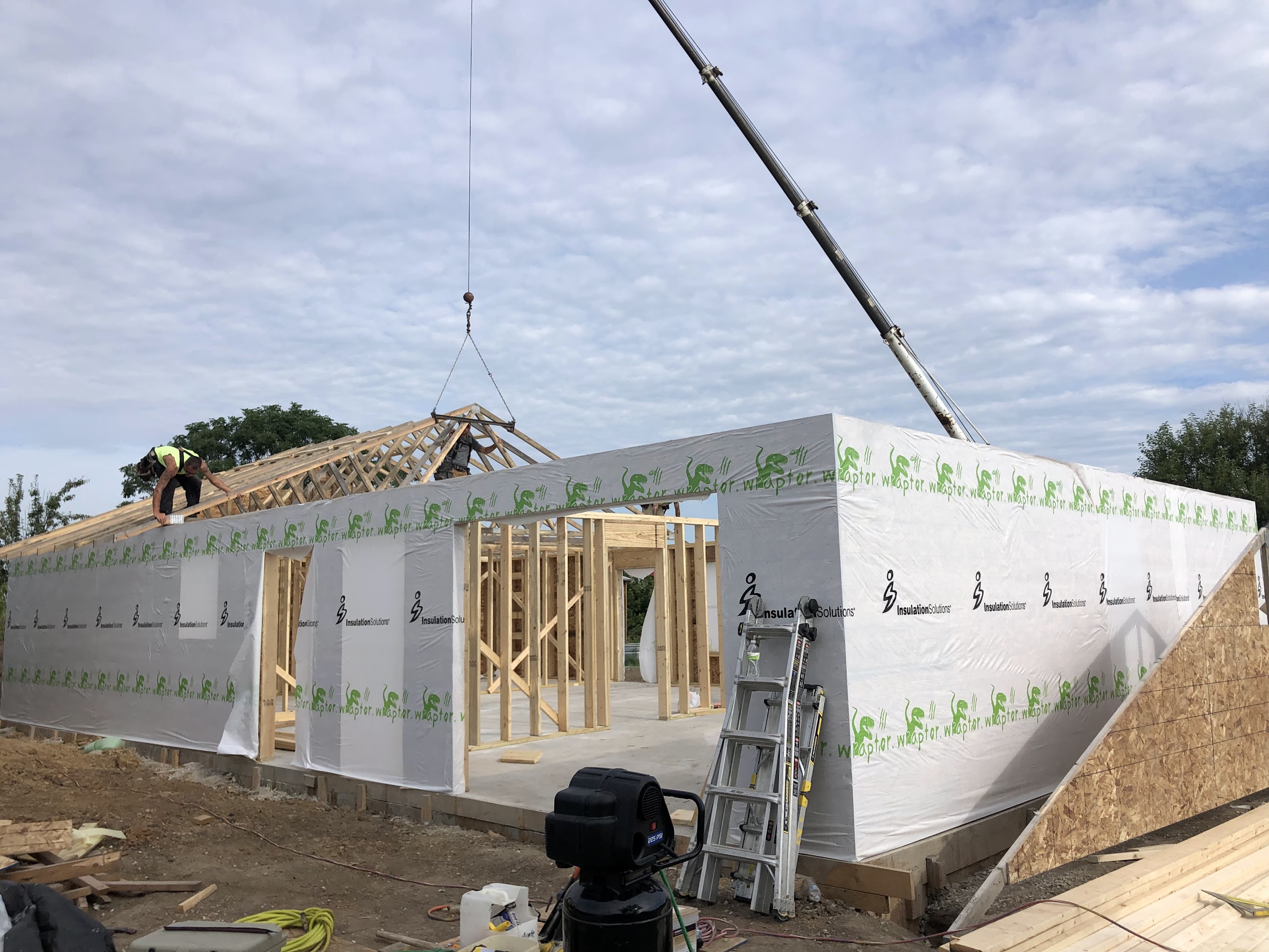 New home framing and truss installation with crane