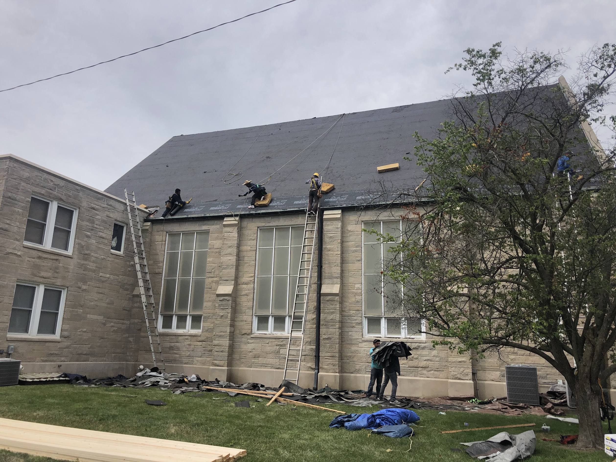 Commercial roofing project on stone building