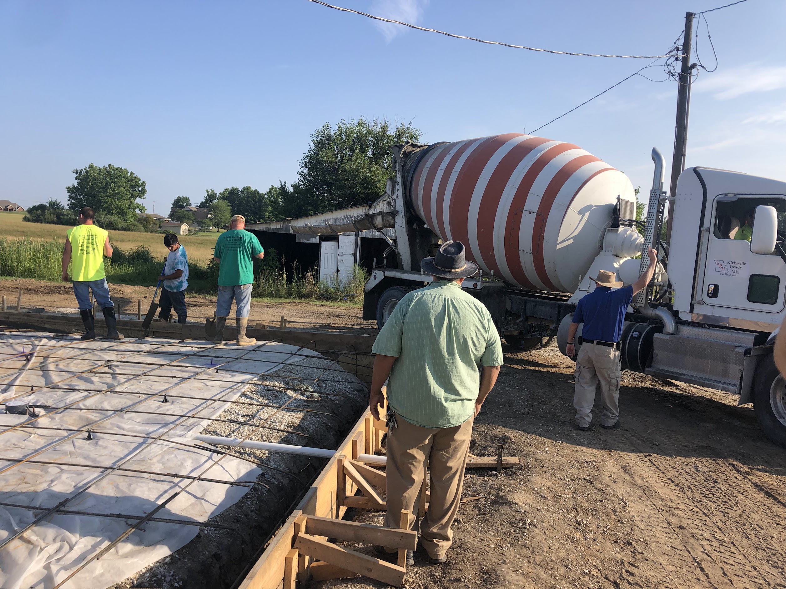 Concrete foundation pour with crew and mixer